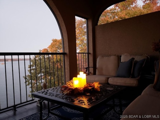 balcony featuring an outdoor fire pit