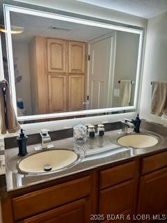 145 Costa Del Sol Dr Unit 2A, Lake Ozark, MO 65049 - full bathroom featuring double vanity
