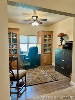 145 Costa Del Sol Dr Unit 2A, Lake Ozark, MO 65049 - office with ceiling fan, wood finished floors, and baseboards