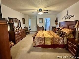 145 Costa Del Sol Dr Unit 2A, Lake Ozark, MO 65049 - carpeted bedroom featuring a textured ceiling and ceiling fan