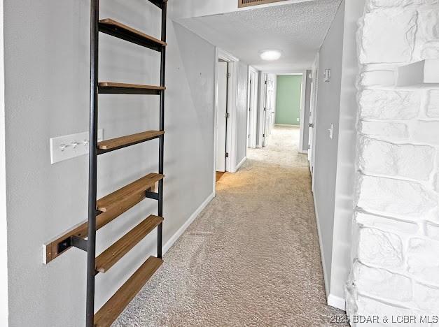1117 Passover Rd Unit K-8, Osage Beach, MO 65065 - hall featuring carpet flooring and a textured ceiling