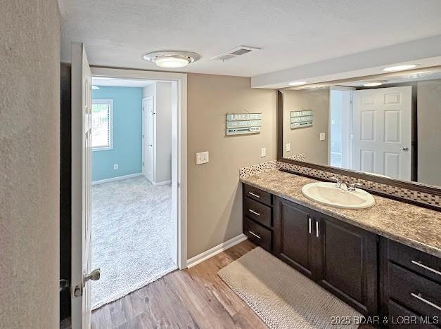 1117 Passover Rd Unit K-8, Osage Beach, MO 65065 - bathroom featuring vanity and wood finished floors