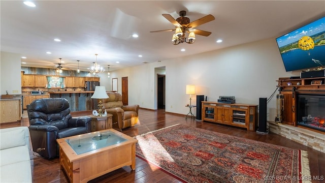 living room featuring recessed lighting, a ceiling fan, and dark wood-style floors