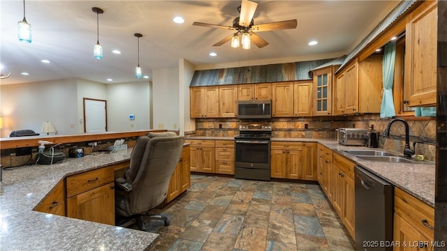 kitchen with stone finish floor, a ceiling fan, backsplash, appliances with stainless steel finishes, and a sink