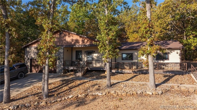 view of front of house with a porch and concrete driveway