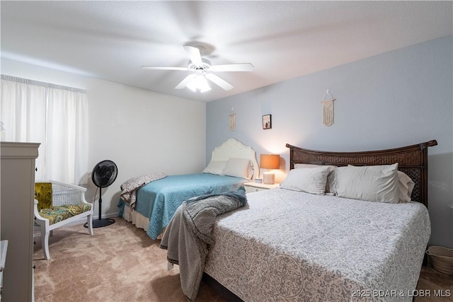 bedroom with light carpet and a ceiling fan