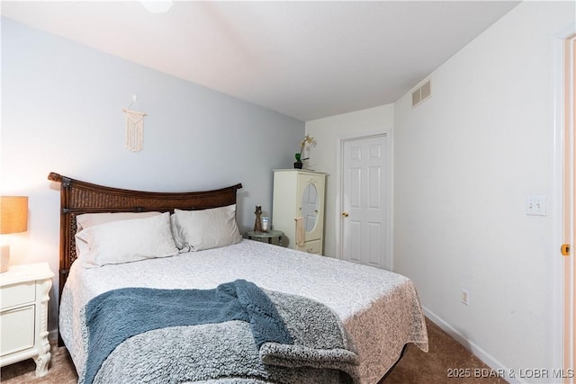 carpeted bedroom featuring baseboards and visible vents