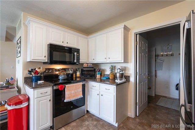 kitchen featuring tile patterned flooring, white cabinetry, a toaster, and stainless steel appliances