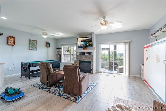 living area with pool table, plenty of natural light, baseboards, and a ceiling fan
