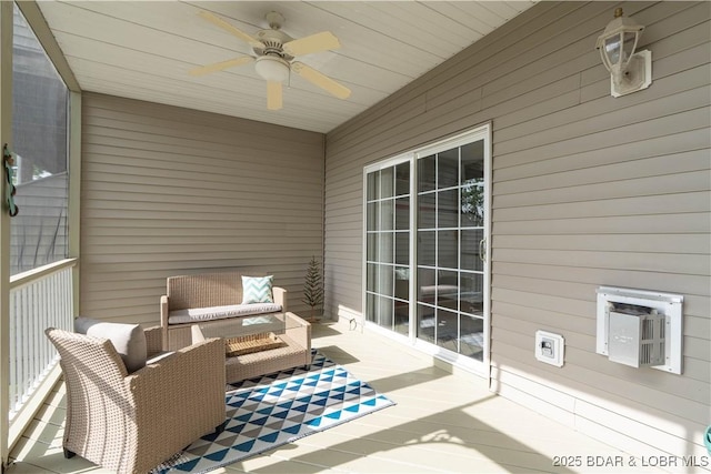 exterior space with ceiling fan and an outdoor living space