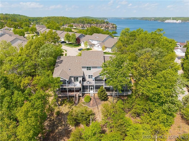 drone / aerial view with a residential view and a water view