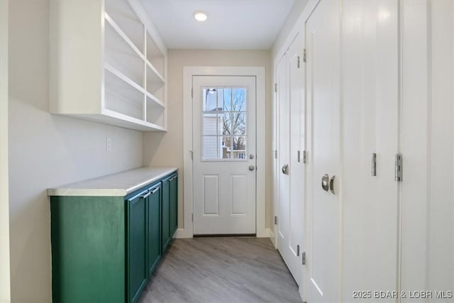 doorway to outside featuring light wood-style flooring