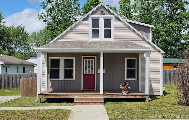 view of outdoor structure with a porch and fence