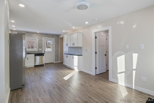421 W High St, Eldon, MO 65026 - kitchen featuring appliances with stainless steel finishes, light wood-type flooring, white cabinets, and recessed lighting
