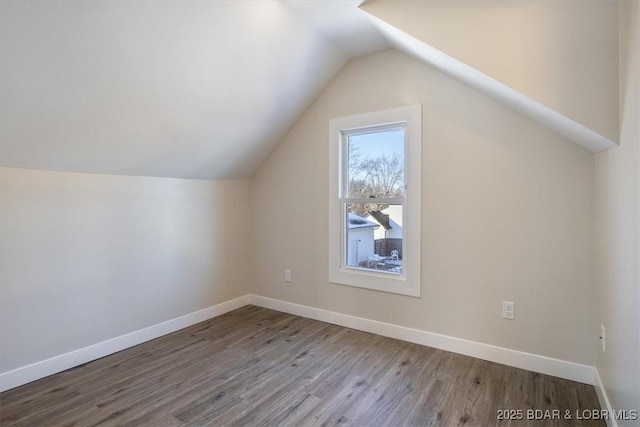 421 W High St, Eldon, MO 65026 - bonus room featuring lofted ceiling, wood finished floors, and baseboards
