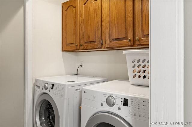 20168 Lost Valley Rd, Warsaw, MO 65355 - washroom featuring washer and clothes dryer and cabinet space