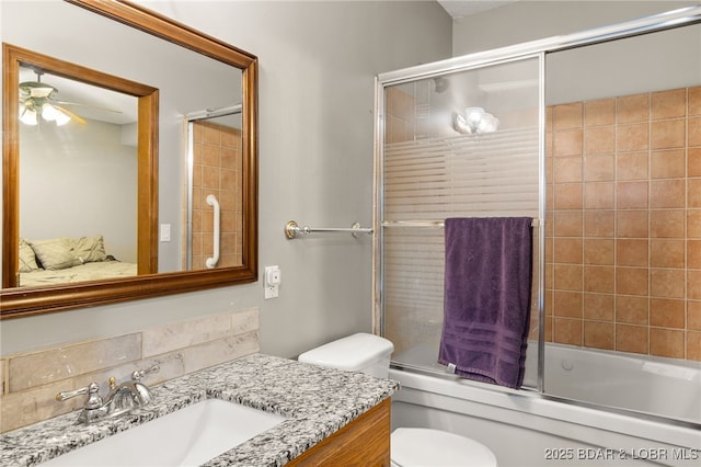 20168 Lost Valley Rd, Warsaw, MO 65355 - full bathroom featuring a ceiling fan, enclosed tub / shower combo, toilet, and vanity