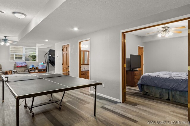 20168 Lost Valley Rd, Warsaw, MO 65355 - game room featuring a ceiling fan, light wood-type flooring, a textured ceiling, baseboards, and recessed lighting