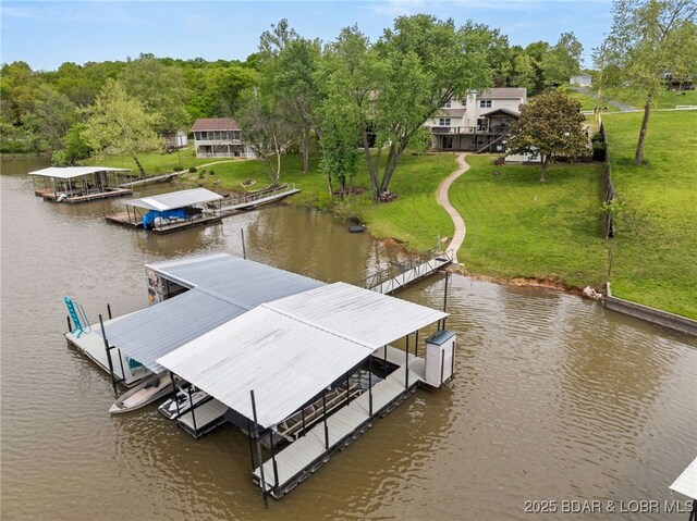 20168 Lost Valley Rd, Warsaw, MO 65355 - dock area with a water view, boat lift, a yard, and view of scattered trees