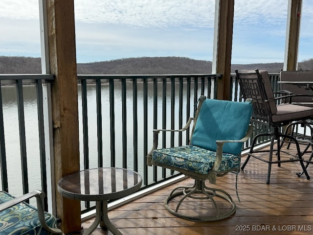 balcony featuring a water view