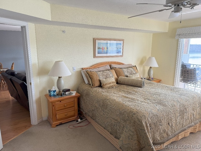 bedroom featuring a ceiling fan and light carpet