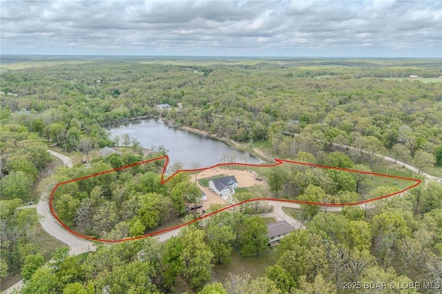 aerial view with a water view and a forest view