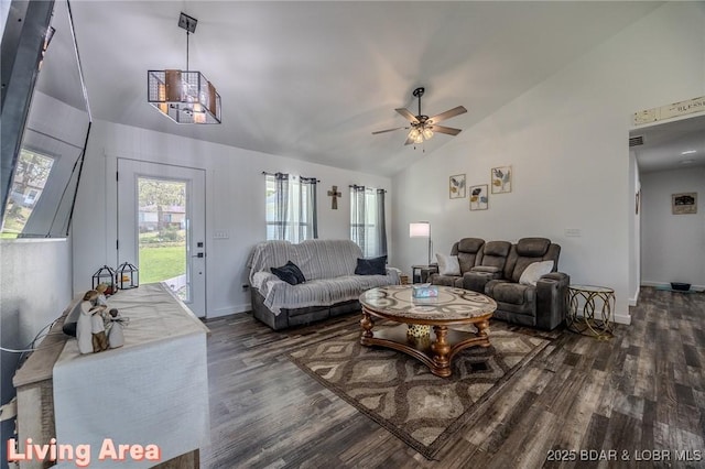 living area featuring baseboards, ceiling fan, high vaulted ceiling, and wood finished floors