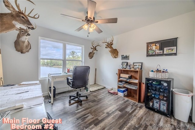 home office featuring baseboards, ceiling fan, and wood finished floors