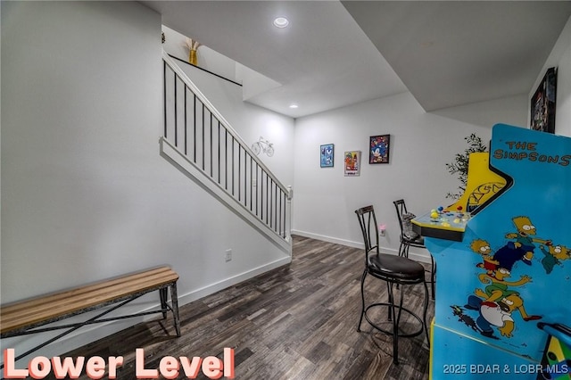 interior space featuring recessed lighting, baseboards, and wood finished floors