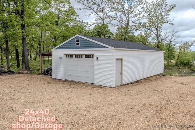 detached garage with dirt driveway