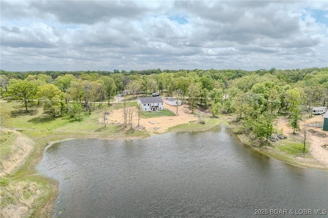 aerial view featuring a water view and a view of trees