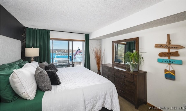 carpeted bedroom with a textured ceiling