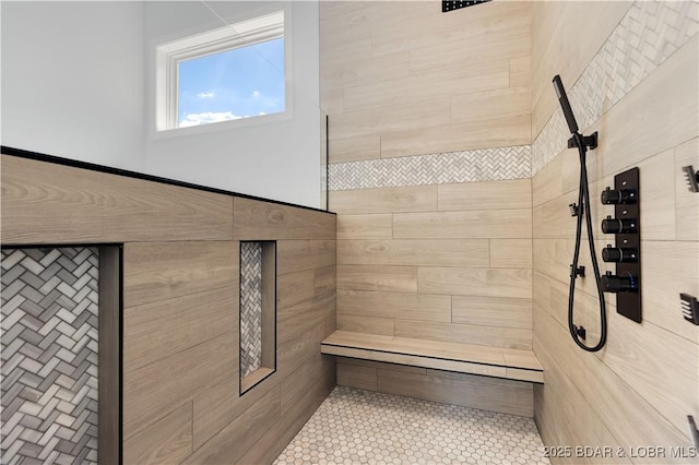 bathroom with tiled shower