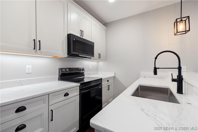 kitchen featuring pendant lighting, light stone counters, a sink, white cabinetry, and black range with electric cooktop