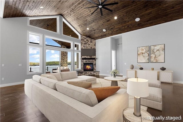 living area featuring baseboards, a ceiling fan, high vaulted ceiling, and wooden ceiling