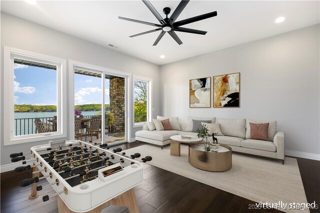 interior space featuring recessed lighting, baseboards, ceiling fan, and hardwood / wood-style flooring