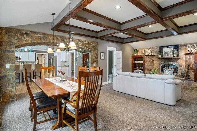 649 Nichol Rd, Edwards, MO 65326 - carpeted dining room with an inviting chandelier, coffered ceiling, beam ceiling, crown molding, and a glass covered fireplace