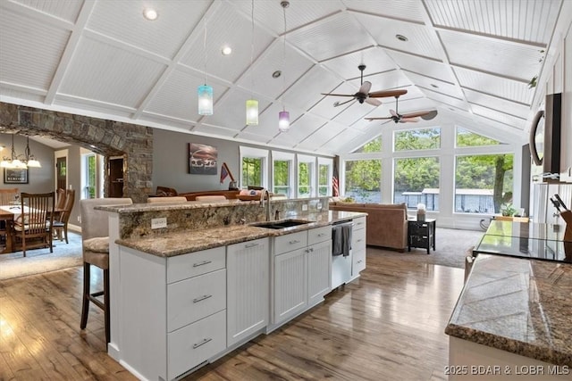 649 Nichol Rd, Edwards, MO 65326 - kitchen featuring wood finished floors, lofted ceiling, open floor plan, and a sink