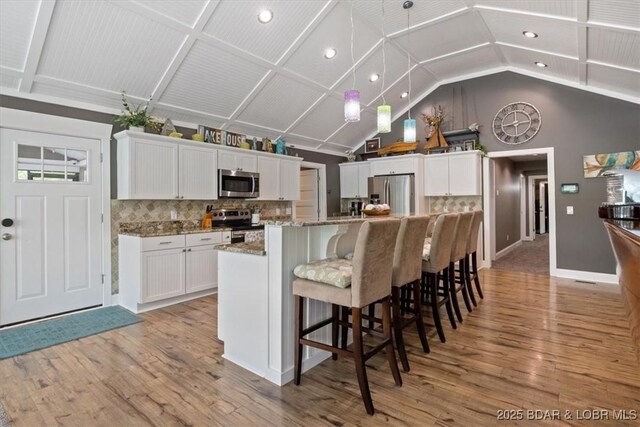 649 Nichol Rd, Edwards, MO 65326 - kitchen with light wood-type flooring, recessed lighting, white cabinets, and appliances with stainless steel finishes