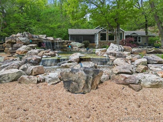 649 Nichol Rd, Edwards, MO 65326 - view of yard with a small pond and a sunroom