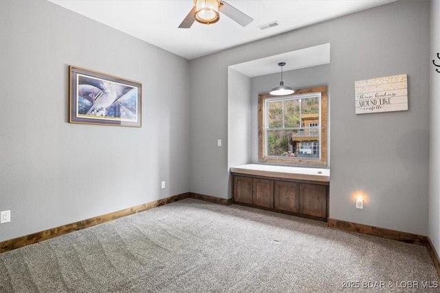 649 Nichol Rd, Edwards, MO 65326 - unfurnished room featuring light carpet, baseboards, a ceiling fan, and visible vents