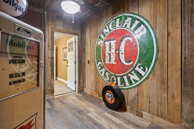 649 Nichol Rd, Edwards, MO 65326 - corridor featuring wood walls, baseboards, and wood finished floors