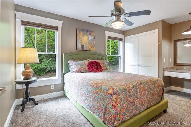 649 Nichol Rd, Edwards, MO 65326 - carpeted bedroom with multiple windows, a closet, baseboards, and a ceiling fan