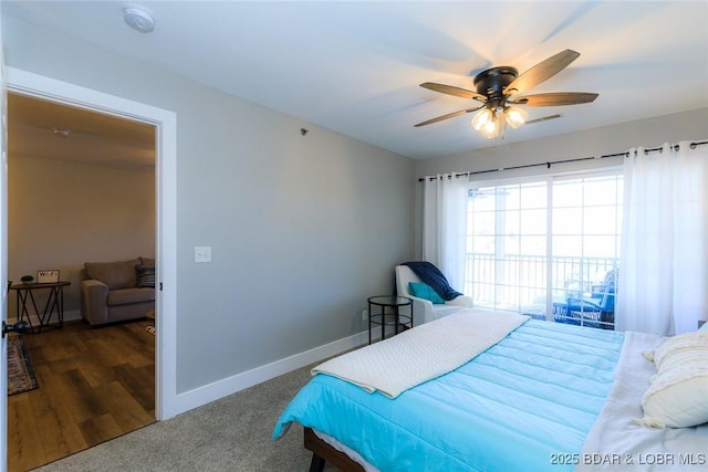 carpeted bedroom featuring baseboards and a ceiling fan