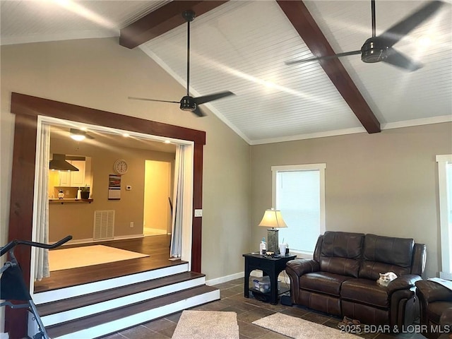 living area with visible vents, baseboards, a ceiling fan, and lofted ceiling with beams