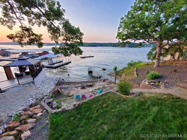 water view with a gazebo and a floating dock