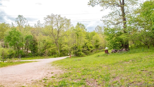 exterior space featuring a wooded view