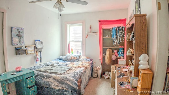 carpeted bedroom featuring ceiling fan