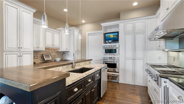 207 Buck Deer Ln, Camdenton, MO 65020 - kitchen with a sink, white cabinetry, and appliances with stainless steel finishes