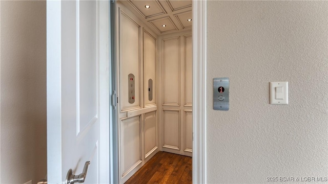 207 Buck Deer Ln, Camdenton, MO 65020 - room details featuring elevator, a textured wall, wood finished floors, and recessed lighting